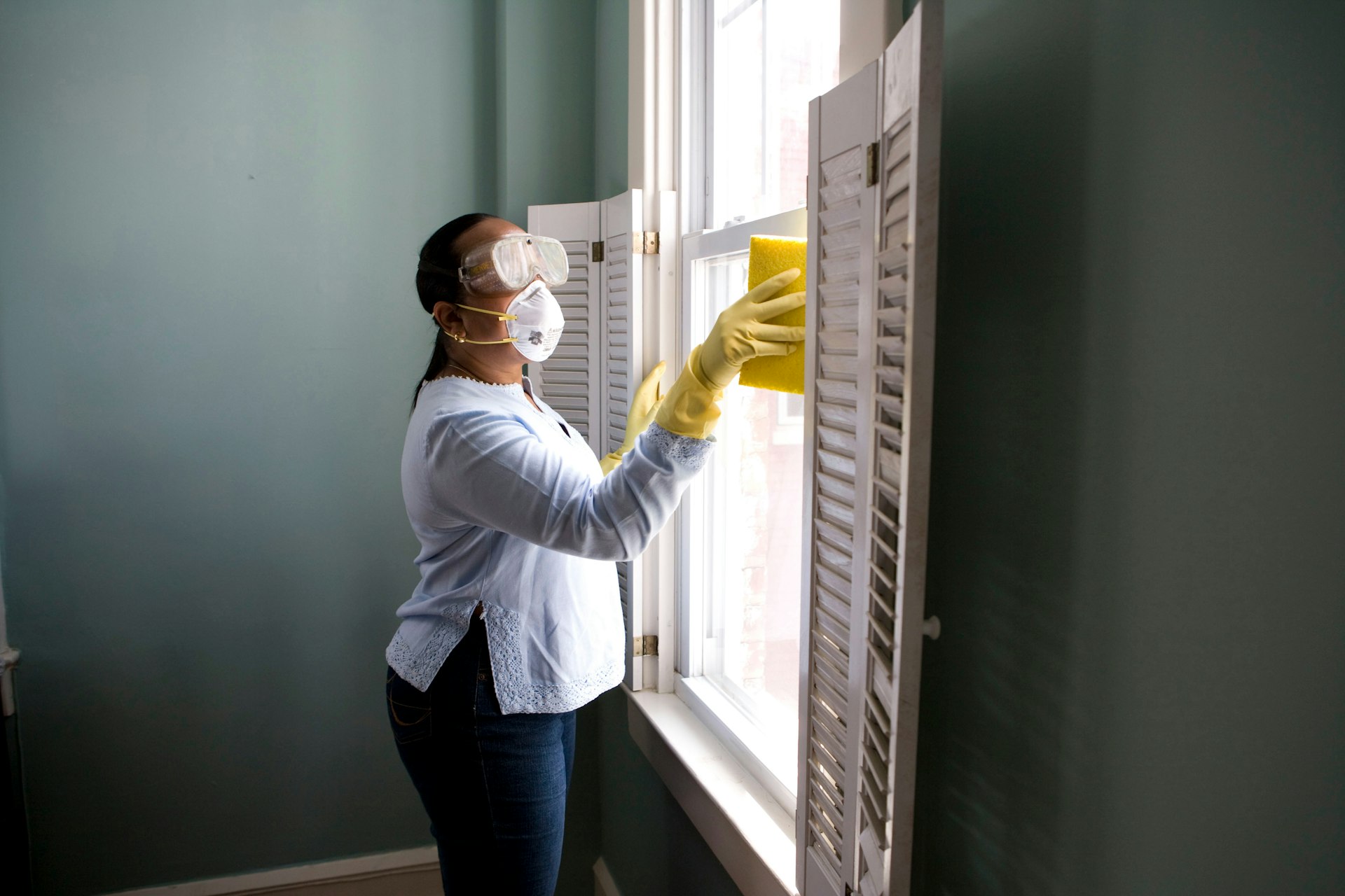 Professional cleaner polishing a kitchen counter